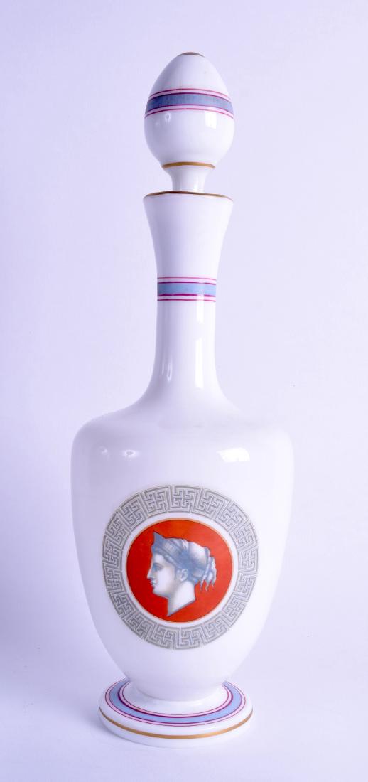 A MID 19TH CENTURY WHITE OPALINE GLASS DECANTER AND: A MID 19TH CENTURY WHITE OPALINE GLASS DECANTER AND STOPPER in the manner of Thomas Webb, decorated with a Romanesque portrait of a female. 32.5 cm high.