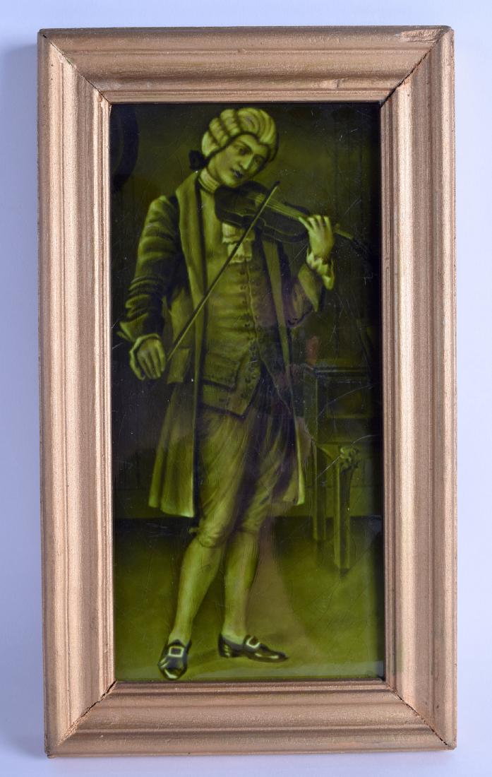AN EARLY 20TH CENTURY FRAMED POTTERY TILE depicting a: AN EARLY 20TH CENTURY FRAMED POTTERY TILE depicting a musician playing an instrument within a landscape. Tile 13 cm x 29 cm.