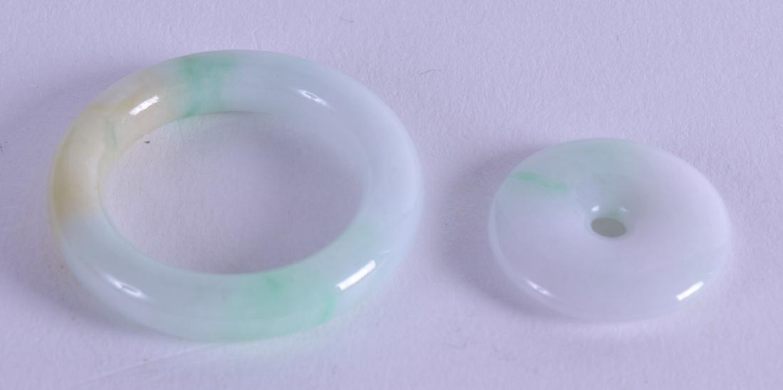 A CHINESE CARVED GREEN JADEITE RING together with a (1 of 2)