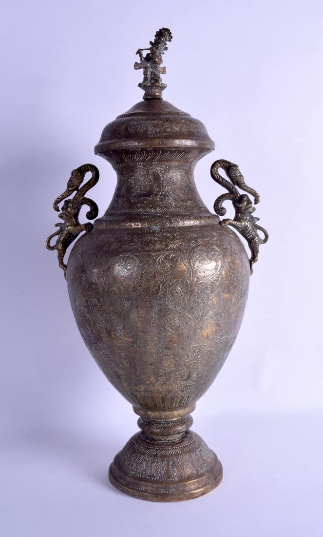 A 19TH CENTURY INDIAN TWIN HANDLED BRASS VASE AND COVER (1 of 2)