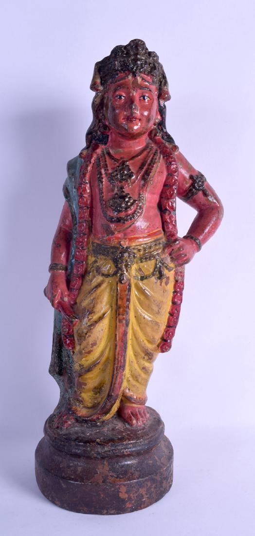 AN 18TH/19TH CENTURY INDIAN POLYCHROMED TERRACOTTA: AN 18TH/19TH CENTURY INDIAN POLYCHROMED TERRACOTTA FIGURE OF A STANDING FEMALE modelled upon a stepped base. 39.5 cm high.