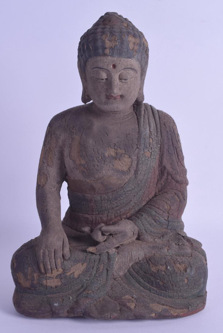 A CHINESE POLYCHROMED WOOD FIGURE OF A BUDDHA modelled: A CHINESE POLYCHROMED WOOD FIGURE OF A BUDDHA modelled seated. 26 cm high.