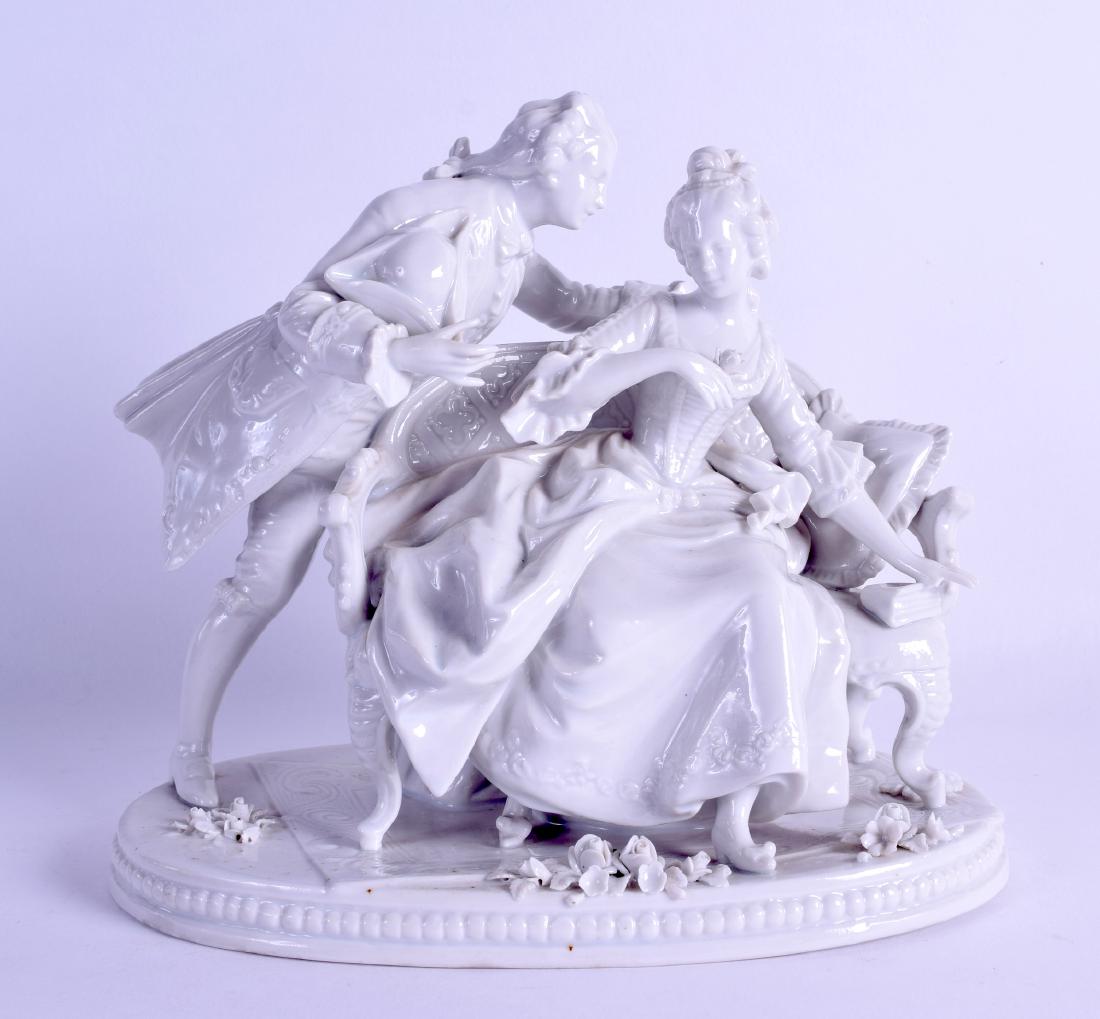 A 19TH CENTURY GERMAN BLANC DE CHINE PORCELAIN FIGURAL: A 19TH CENTURY GERMAN BLANC DE CHINE PORCELAIN FIGURAL GROUP depicting a male and female upon a sofa. 20 cm wide.