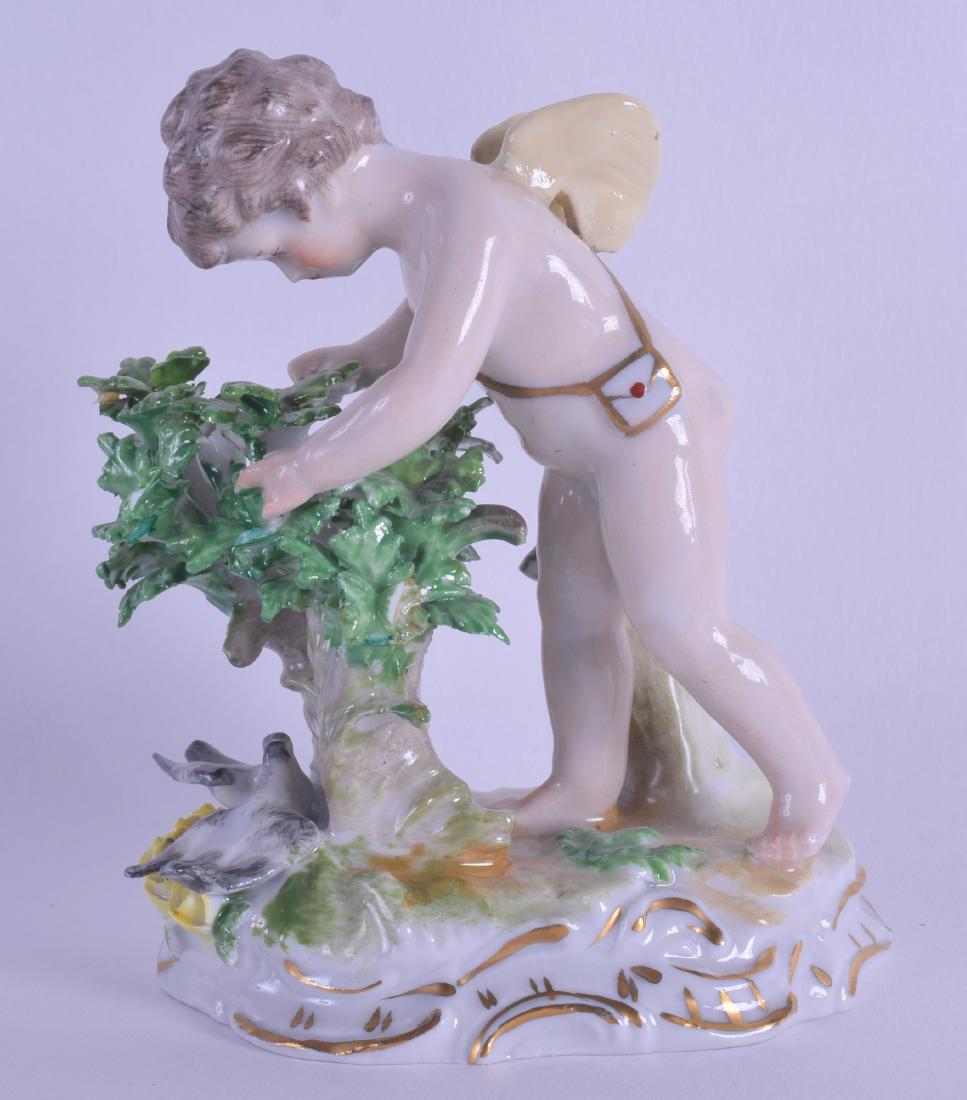 A DRESDEN PORCELAIN FIGURE OF A PUTTI modelled beside (1 of 2)