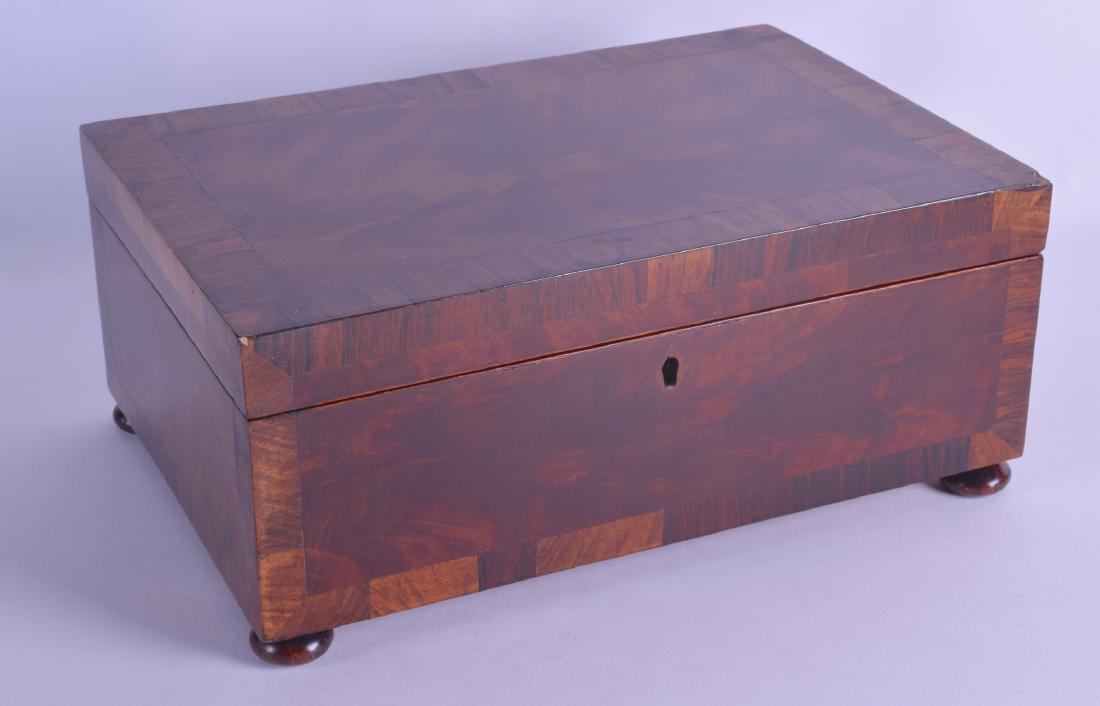 A MID VICTORIAN ROSEWOOD STATIONARY CASKET of: A MID VICTORIAN ROSEWOOD STATIONARY CASKET of rectangular form with fitted interior. 30 cm x 20 cm.
