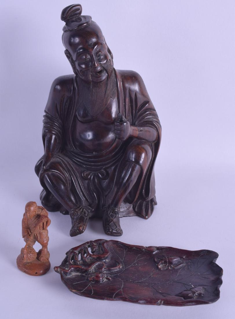 A 19TH CENTURY CHINESE CARVED HARDWOOD FIGURE OF A (1 of 2)