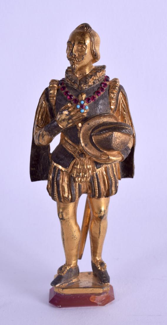 A 19TH CENTURY GERMAN GILT BRONZE FIGURE OF A STANDING: A 19TH CENTURY GERMAN GILT BRONZE FIGURE OF A STANDING MALE modelled upon an agate base. 11 cm high.