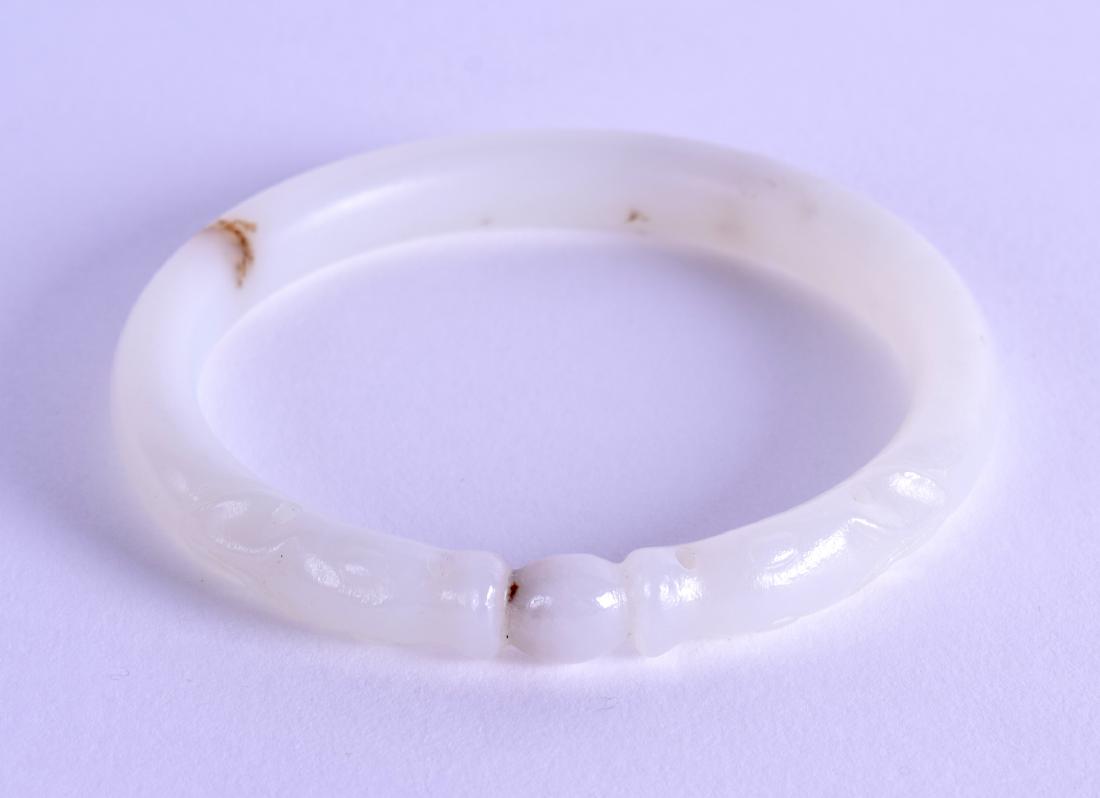 AN EARLY 20TH CENTURY CHINESE CARVED WHITE JADE CHILONG (1 of 2)