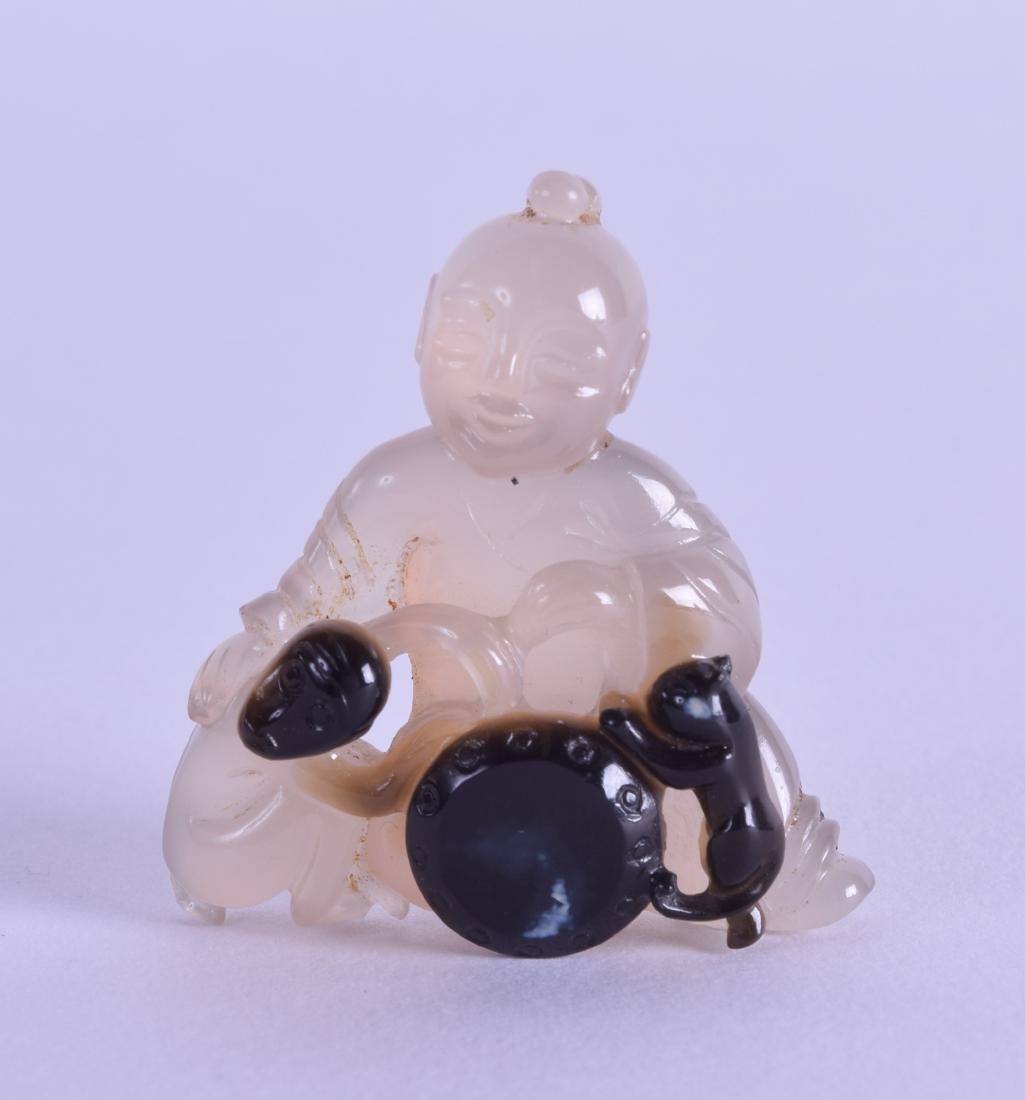 A LOVELY CHINESE CARVED AGATE FIGURE OF A BOY modelled (1 of 3)