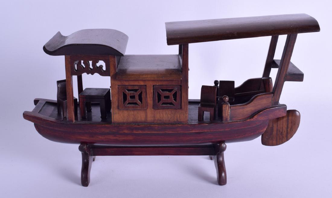 AN EARLY 20TH CENTURY CHINESE CARVED HARDWOOD JUNK BOAT (1 of 2)