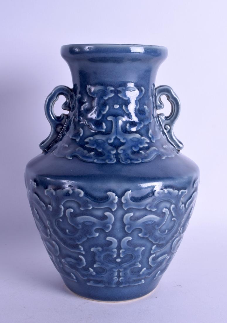 A CHINESE QING DYNASTY TWIN HANDLED BLUE VASE decorated (1 of 3)