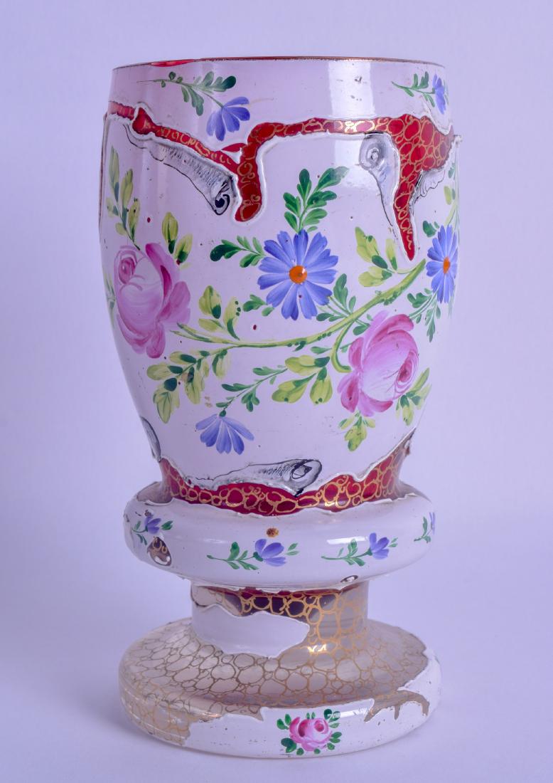 AN UNUSUAL LATE 19TH CENTURY BOHEMIAN ENAMLLED BEAKER: AN UNUSUAL LATE 19TH CENTURY BOHEMIAN ENAMLLED BEAKER overlaid with white enamelled foliage upon a crackled ground. 15 cm high.