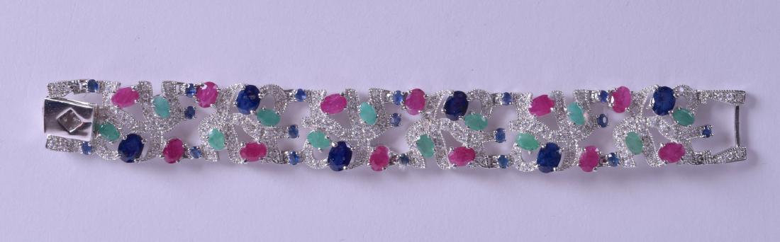 A SILVER RUBY EMERALD AND SAPPHIRE COCKTAIL BRACELET. (1 of 2)