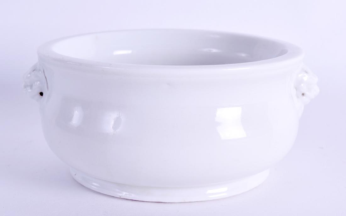 AN EARLY 18TH CENTURY CHINESE BLANC DE CHINE CENSER: AN EARLY 18TH CENTURY CHINESE BLANC DE CHINE CENSER Kangxi/Yongzheng, with buddhistic mask head handles. 13.5 cm wide. Provenance: Brooke Robinson Collection.