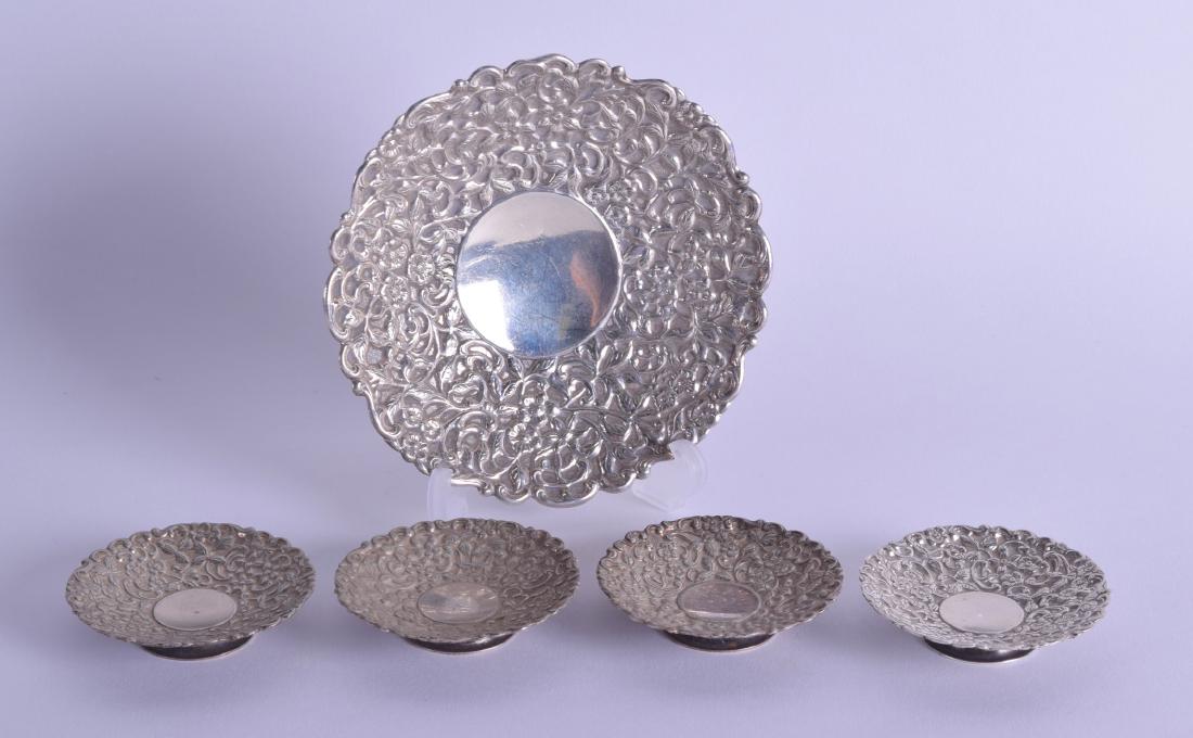 A 19TH CENTURY INDIAN SILVER EMBOSSED FLORAL DISH (1 of 3)