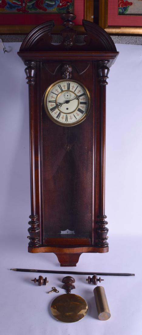 A LARGE LATE 19TH CENTURY VIENNA REGULATOR HANGING WALL: A LARGE LATE 19TH CENTURY VIENNA REGULATOR HANGING WALL CLOCK with mask head mounts and circular dial. 110 cm x 36 cm.