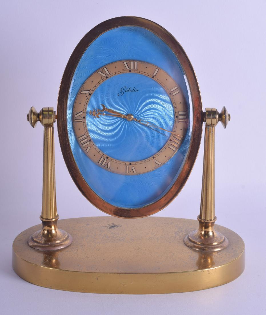 A 1950S BRASS AND BLUE ENAMEL GUBELIN SWINGING MANTEL (1 of 2)