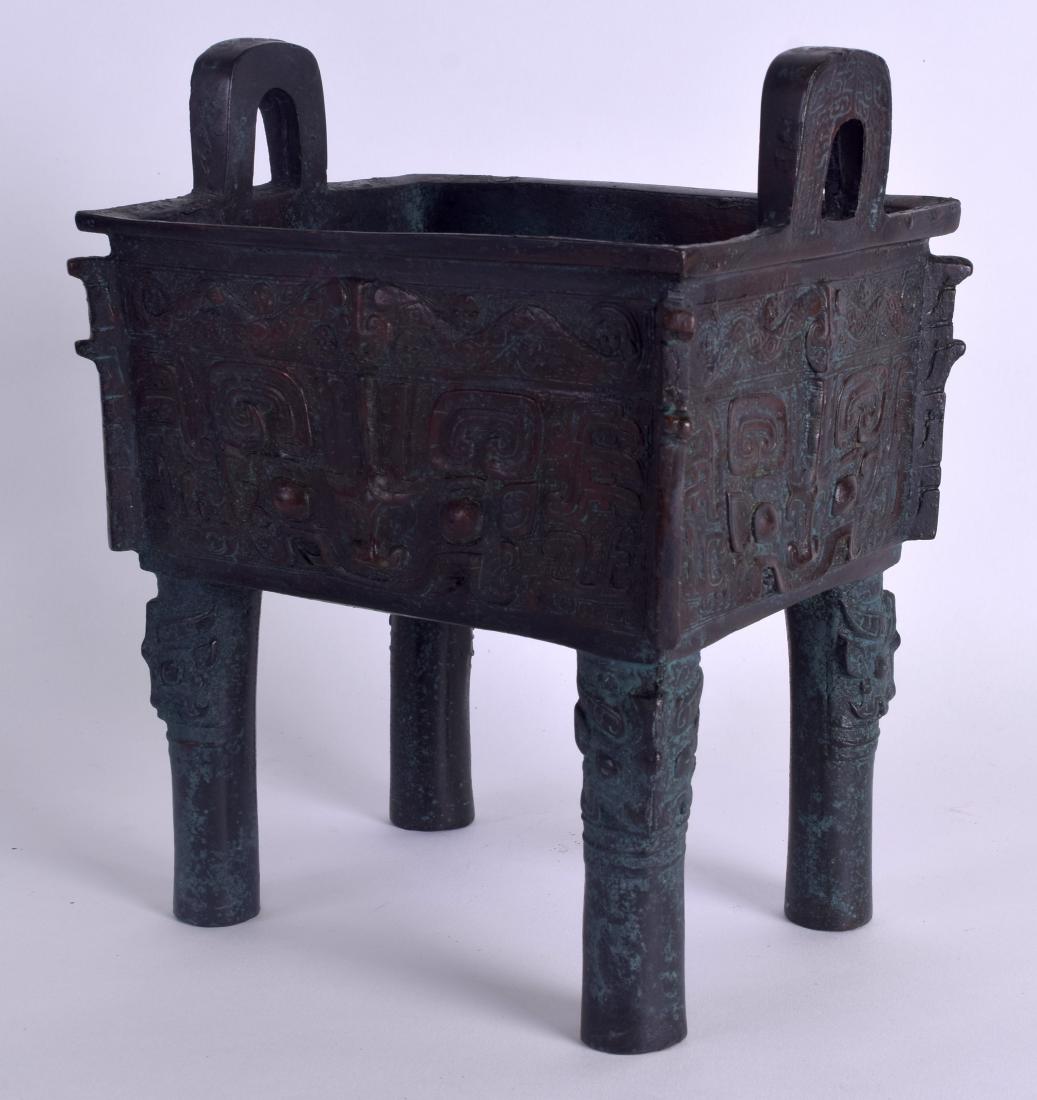A CHINESE SHANG DYNASTY STYLE BRONZE FANG DING FOOD (1 of 5)
