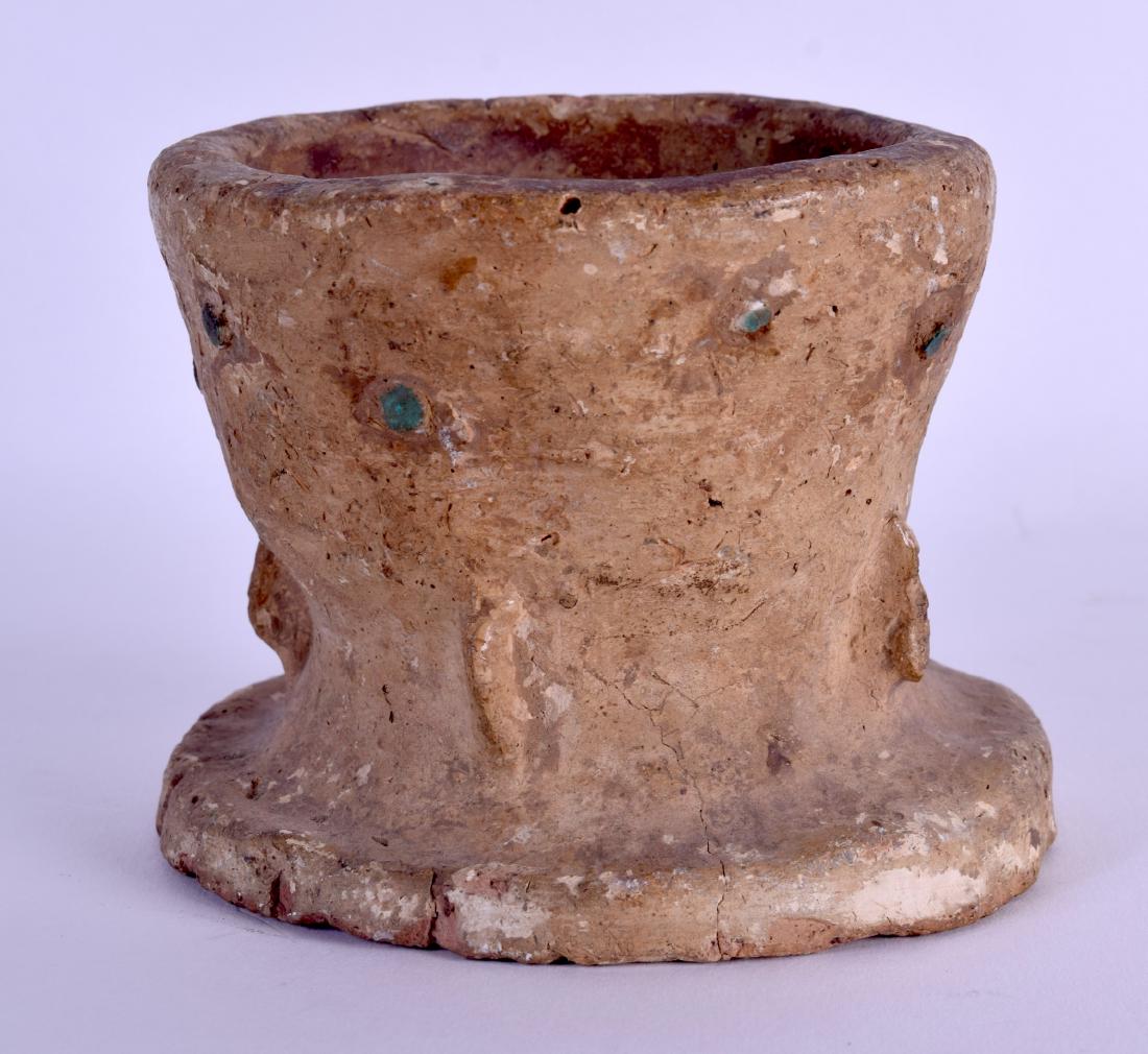 AN EARLY CENTRAL ASIAN TERRACOTTA POTTERY MORTAR with: AN EARLY CENTRAL ASIAN TERRACOTTA POTTERY MORTAR with sparse turquoise decoration. 11.5 cm x 10 cm.