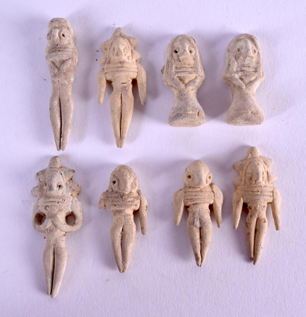 A COLLECTION OF EARLY INDUS VALLEY MINIATURE AMULETS in: A COLLECTION OF EARLY INDUS VALLEY MINIATURE AMULETS in various forms and sizes. Largest 4.5 cm high. (8)