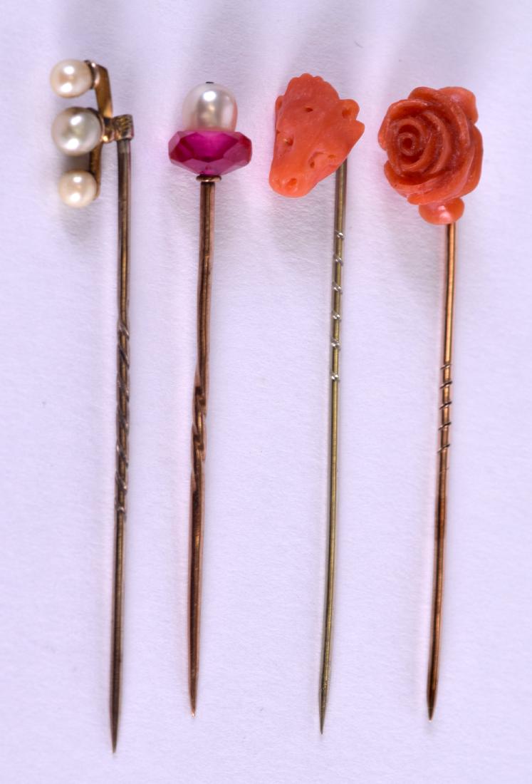 FOUR ANTIQUE STICK PINS including a carved coral lion (1 of 2)