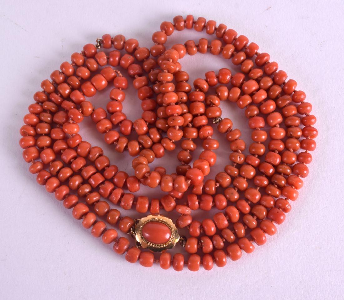AN 18CT GOLD AND RED CORAL NECKLACE with coral inset (1 of 3)