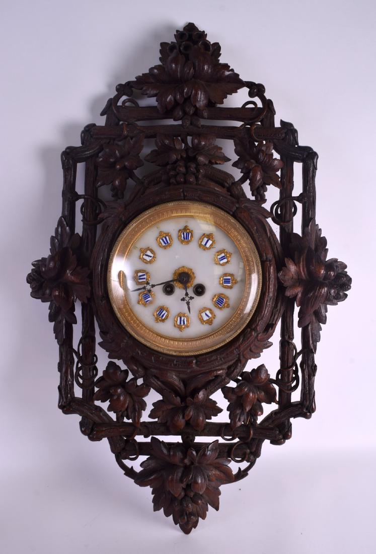 A LARGE 19TH CENTURY BAVARIAN BLACK FOREST HANGING WALL: A LARGE 19TH CENTURY BAVARIAN BLACK FOREST HANGING WALL CLOCK with unusual marble dial embellished in enamelled numerals. 80 cm x 48 cm.