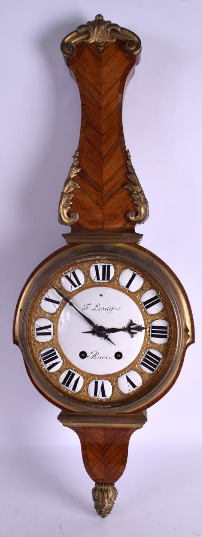 A MID 19TH CENTURY FRENCH KINGWOOD AND ORMOLU HANGING: A MID 19TH CENTURY FRENCH KINGWOOD AND ORMOLU HANGING WALL CLOCK with large circular enamelled dial and black painted numerals. 76 cm x 22 cm.