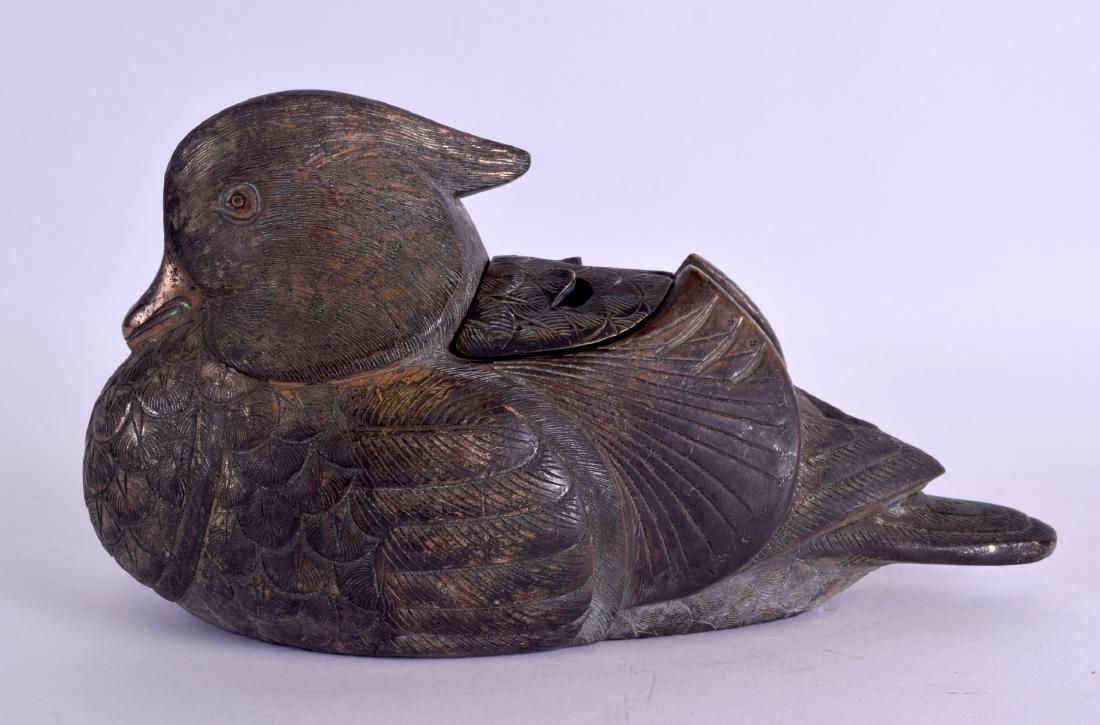 AN UNUSUAL 19TH CENTURY CHINESE ENGRAVED BRONZE: AN UNUSUAL 19TH CENTURY CHINESE ENGRAVED BRONZE INCENSER AND COVER Qing, in the form of a recumbent duck. 18 cm wide.