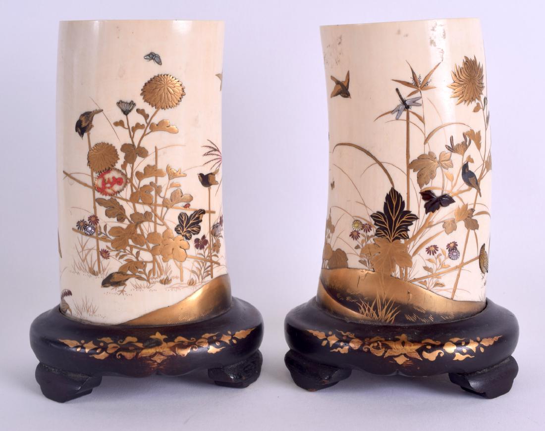 A PAIR OF 19TH CENTURY JAPANESE MEIJI PERIOD SHIBAYMA: A PAIR OF 19TH CENTURY JAPANESE MEIJI PERIOD SHIBAYMA LACQUERED TUSK VASES decorated with birds and insects amongst foliage. 12 cm high.
