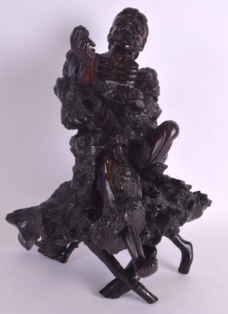 A 19TH CENTURY CHINESE CARVED ROOTWOOD FIGURE OF AN (1 of 4)