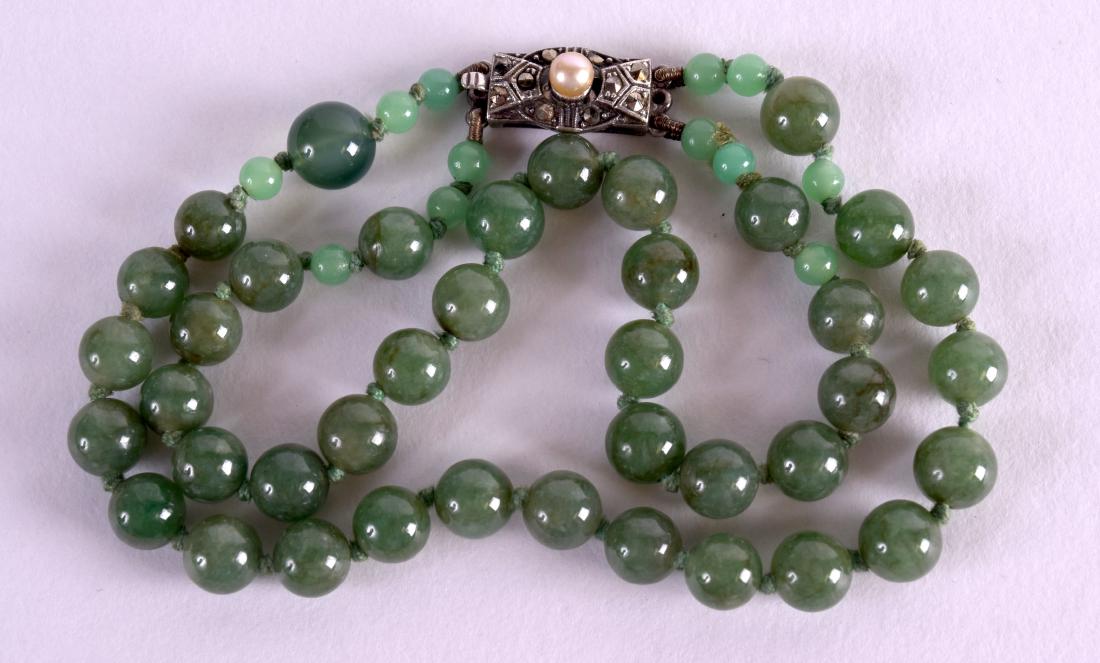 A 1920 CHINESE SILVER AND JADE BRACELET. Each strand 18 (1 of 3)