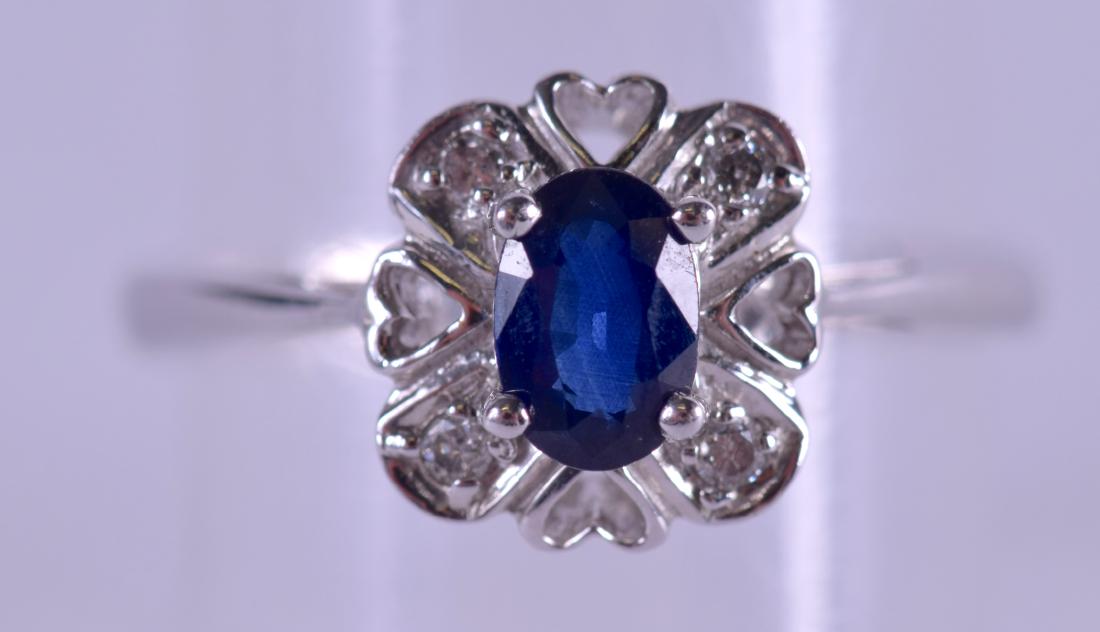 A 9CT GOLD DIAMOND AND SAPPHIRE RING. 2.6 grams. Size (1 of 3)