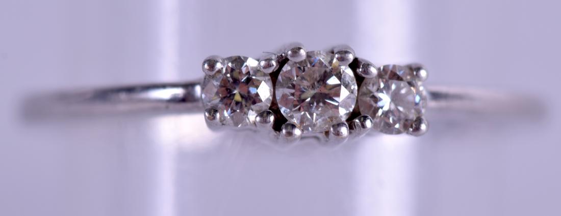 AN 18CT WHITE GOLD AND DIAMOND THREE STONE RING. 2.3 (1 of 3)