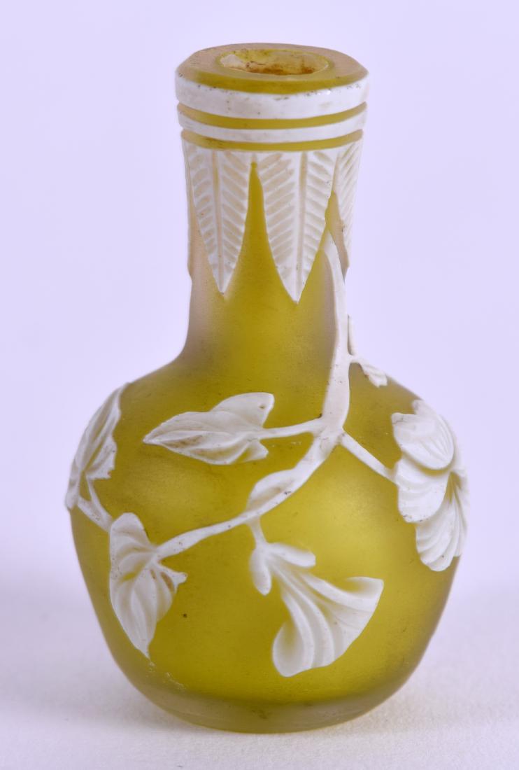 A MINIATURE CAMEO GLASS VASE Attributed to Thomas Webb,: A MINIATURE CAMEO GLASS VASE Attributed to Thomas Webb, decorated with flowers on a yellow ground. 4.5 cm high.