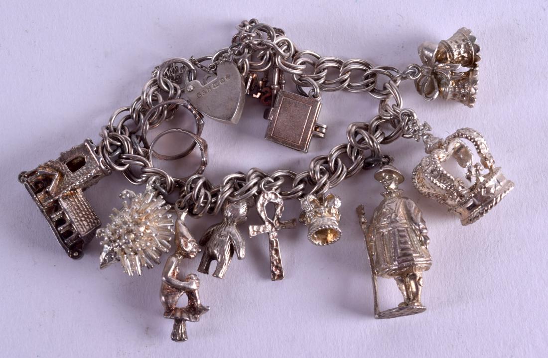 A SILVER CHARM BRACELET. 58 grams. (1 of 3)