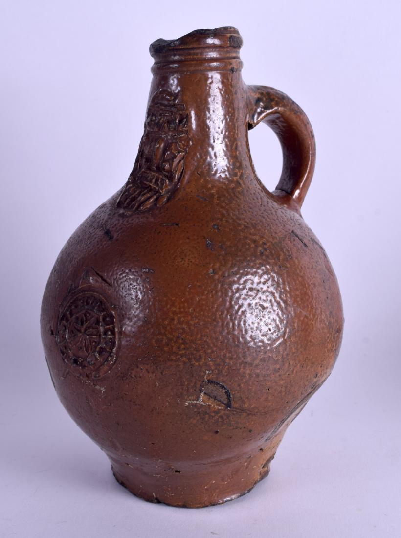 AN EARLY 17TH CENTURY GERMAN BELLARMINE JUG decorated (1 of 3)