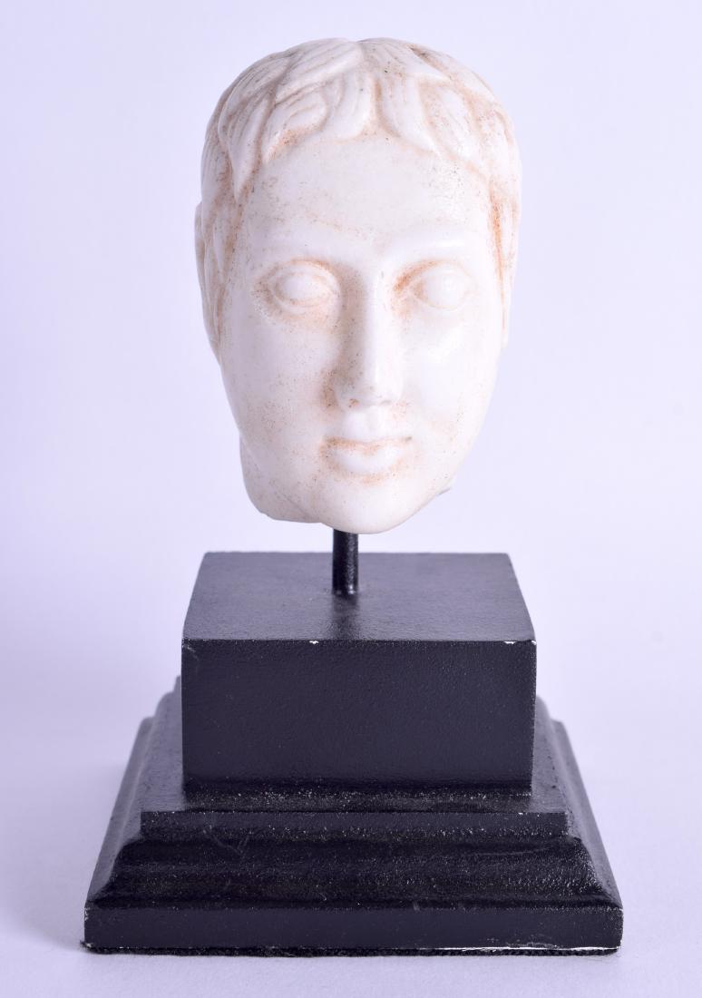 A CONTINENTAL CARVED STONE HEAD OF A MALE possibly (1 of 3)