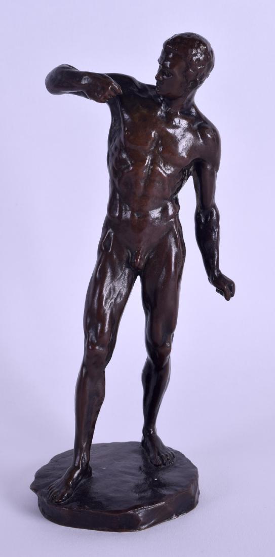 A 19TH CENTURY EUROPEAN BRONZE FIGURE OF A NUDE MALE: A 19TH CENTURY EUROPEAN BRONZE FIGURE OF A NUDE MALE modelled with one arm raised upon a circular base. 20 cm high.