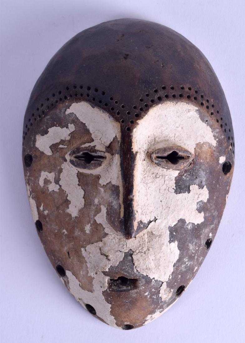 AN AFRICAN PAINTED TRIBAL MASK with white polychromed (1 of 2)