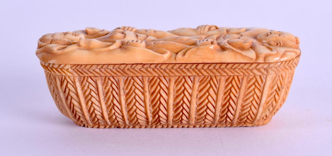 A CHINESE CARVED AND STAINED BONE SNUFF BOX decorated: A CHINESE CARVED AND STAINED BONE SNUFF BOX decorated with two erotic figures. 7.5 cm x 3.5 cm.