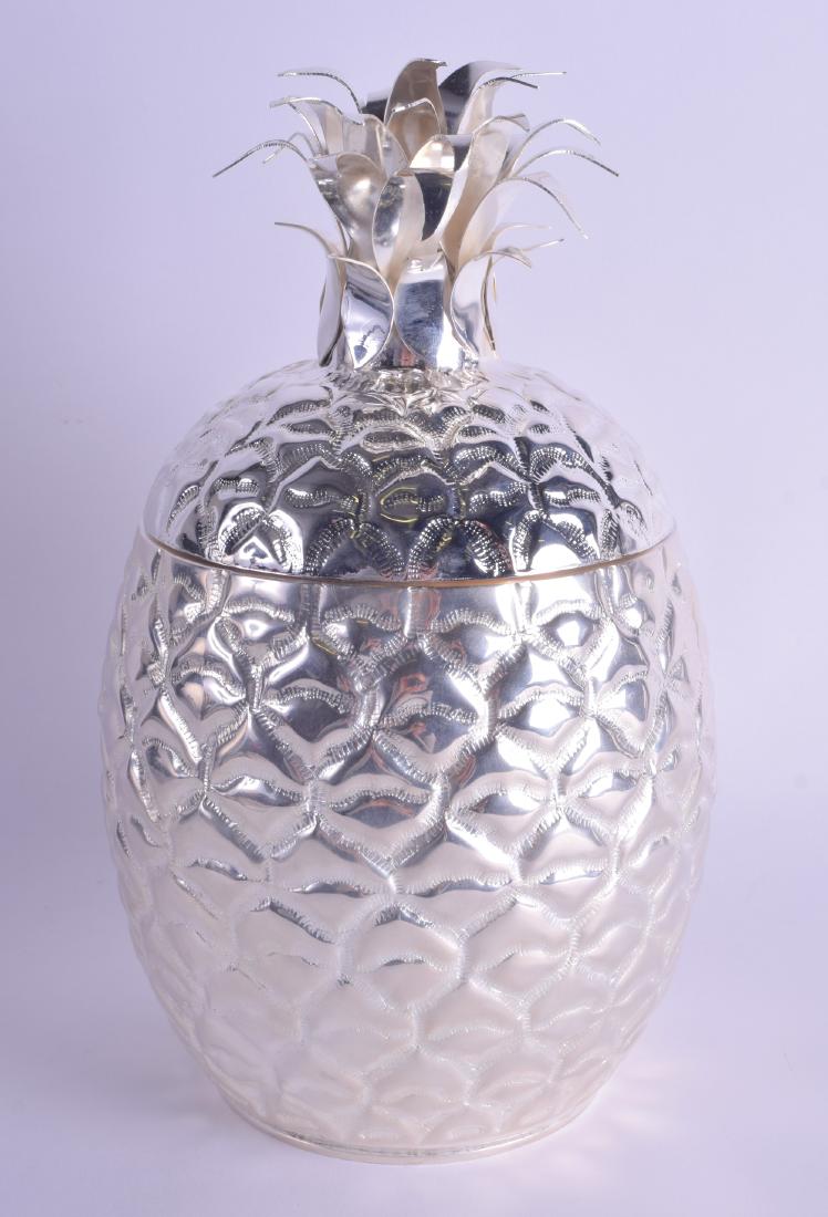 A LARGE SILVER PLATED PINEAPPLE BOTTLE HOLDER. 34 cm: A LARGE SILVER PLATED PINEAPPLE BOTTLE HOLDER. 34 cm high.