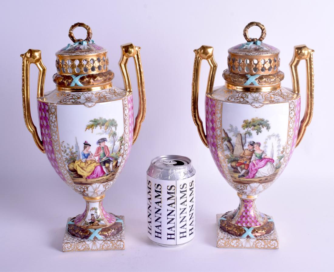 A GOOD PAIR OF 19TH CENTURY GERMAN AUGUSTUS REX VASES: A GOOD PAIR OF 19TH CENTURY GERMAN AUGUSTUS REX VASES AND COVERS painted with figures courting within landscapes. 30 cm x 15 cm.