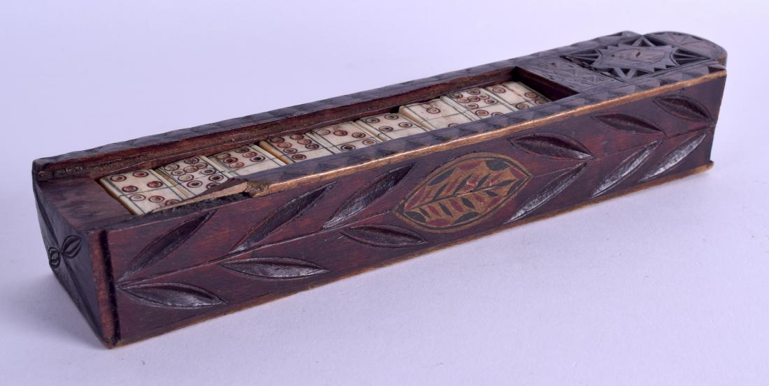 AN 18TH/19TH CENTURY CONTINTAL RECTANGULAR GAMING BOX: AN 18TH/19TH CENTURY CONTINTAL RECTANGULAR GAMING BOX containing numerous painted bone dominos and dice. Box 23 cm long.