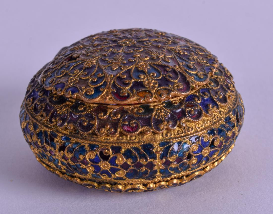 A MID 19TH CENTURY FRENCH YELLOW METAL AND PLIQUE A: A MID 19TH CENTURY FRENCH YELLOW METAL AND PLIQUE A JOUR ENAMEL BOX decorated with foliage. 5.25 cm wide.