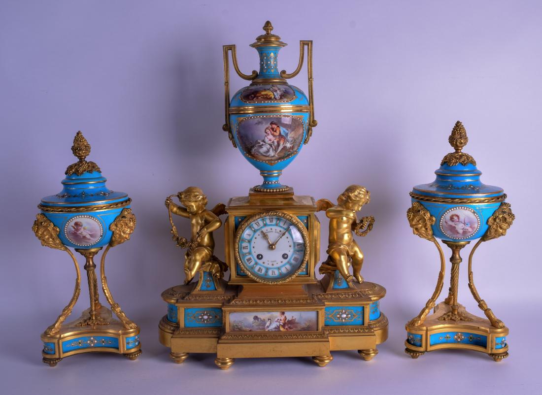A FINE MID 19TH CENTURY FRENCH SEVRES PORCELAIN AND: A FINE MID 19TH CENTURY FRENCH SEVRES PORCELAIN AND ORMOLU CLOCK GARNITURE signed Raingo Fres A Paris, painted with classical figures and decorated with jewels. Mantel 48 cm x 32 cm. (3)