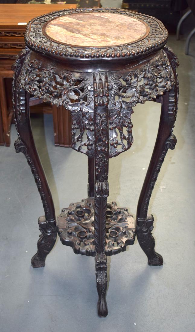 A 19TH CENTURY CHINESE CARVED HONGMU MARBLE INSET STAND: A 19TH CENTURY CHINESE CARVED HONGMU MARBLE INSET STAND Qing, with carved under tier. 92 cm x 40 cm.