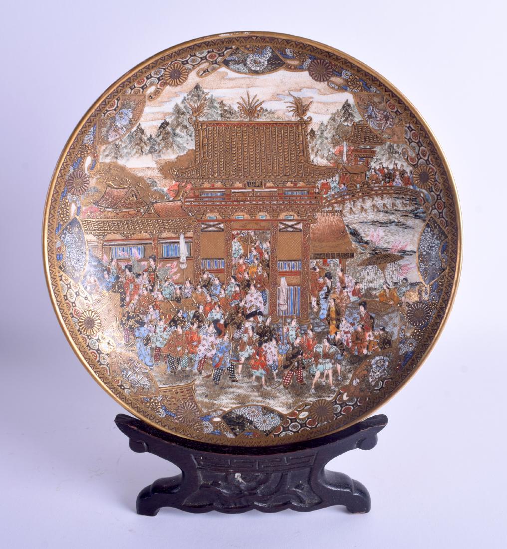 A GOOD 19TH CENTURY JAPANESE MEIJI PERIOD SATSUMA DISH: A GOOD 19TH CENTURY JAPANESE MEIJI PERIOD SATSUMA DISH painted with hundreds of figures within a landscape. 22 cm diameter.