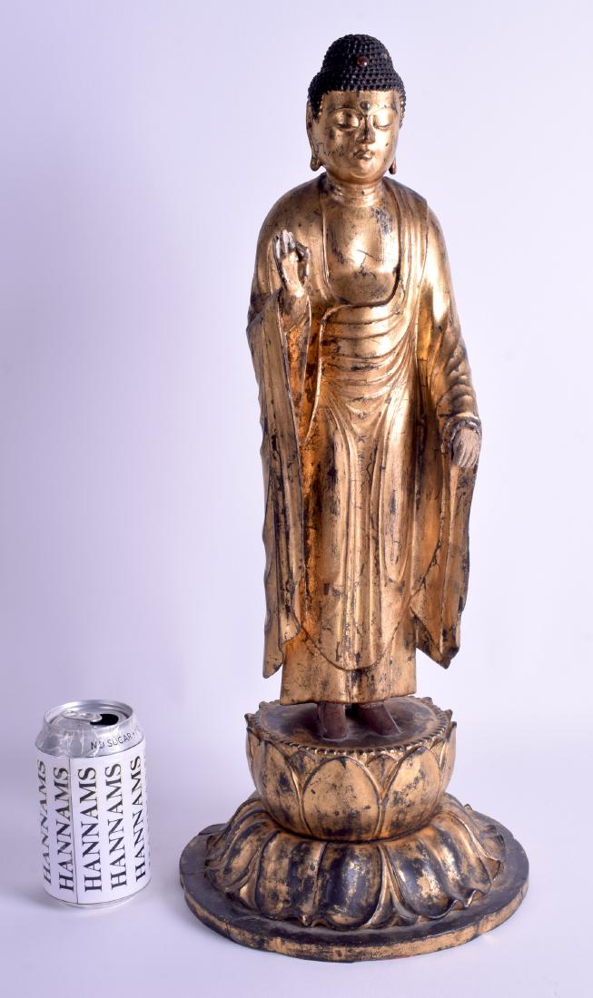 A LARGE 18TH/19TH CENTURY JAPANESE EDO PERIOD GOLD: A LARGE 18TH/19TH CENTURY JAPANESE EDO PERIOD GOLD LACQUERED BUDDHA modelled standing upon a lotus throne. 50 cm high.