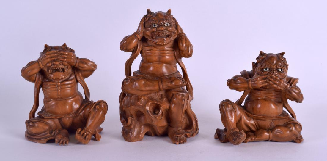 A FINE SET OF THREE 19TH CENTURY JAPANESE MEIJI PERIOD: A FINE SET OF THREE 19TH CENTURY JAPANESE MEIJI PERIOD BOXWOOD OKIMONO depicting the three wise oni, by Kogetsu, wonderfully carved in various pursuits. Largest 14 cm x 9 cm. (3)